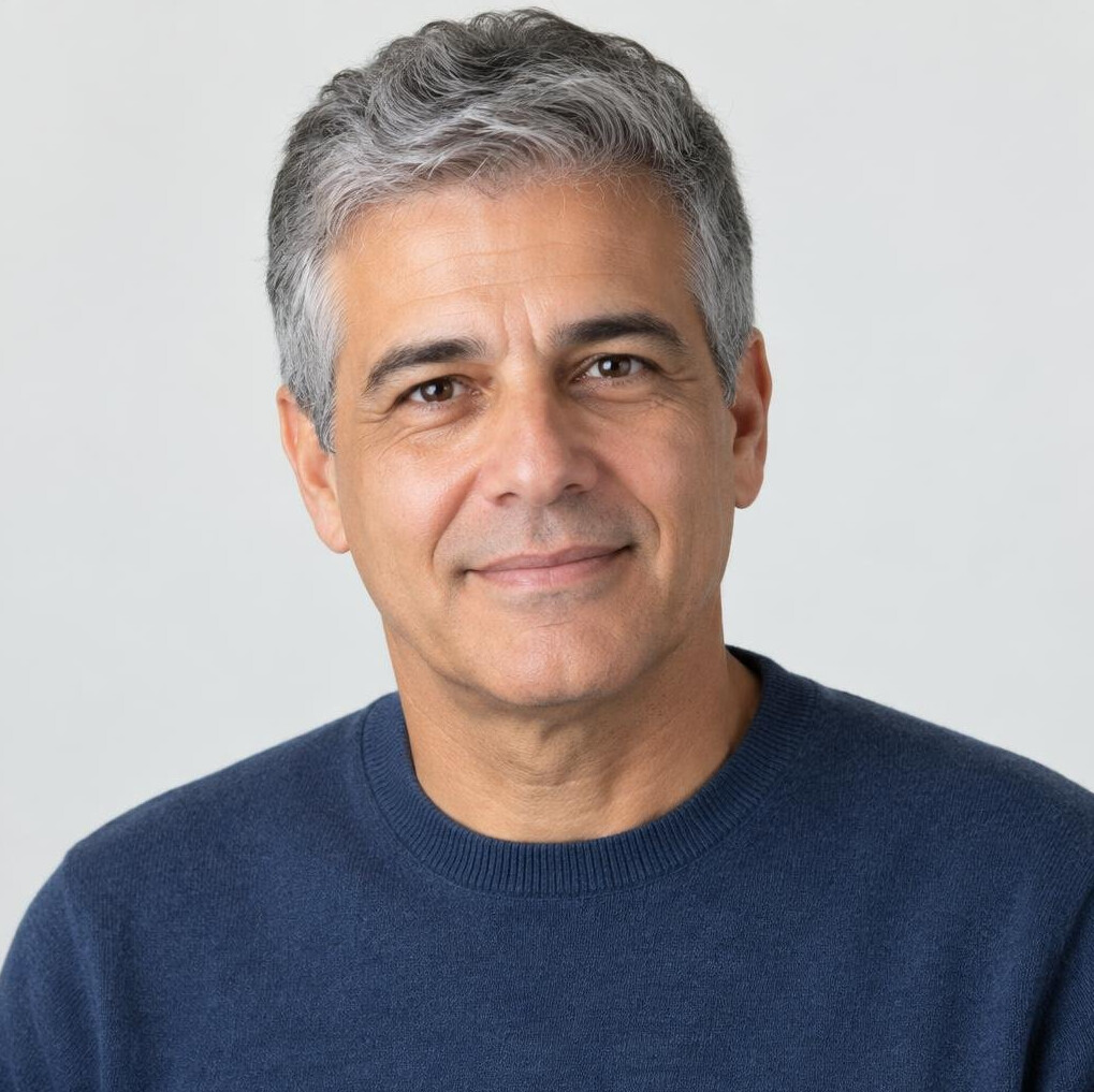 Studio portrait of an older Brazilian man with gray hair